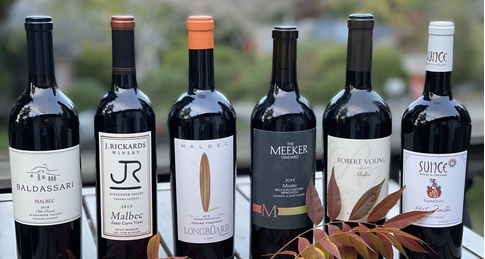 Six Red Wine Bottles from local wineries lined up