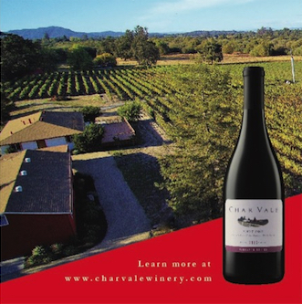 A top view of the winery and vineyards behind a bottle of Char Vale wine.