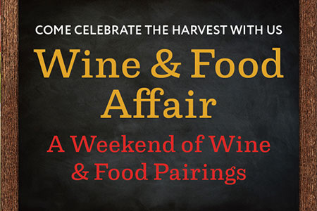 Sign reads Come Celebrate the Harvest with Us Wine & Food Affair A Weekend of Wine & Food Pairings